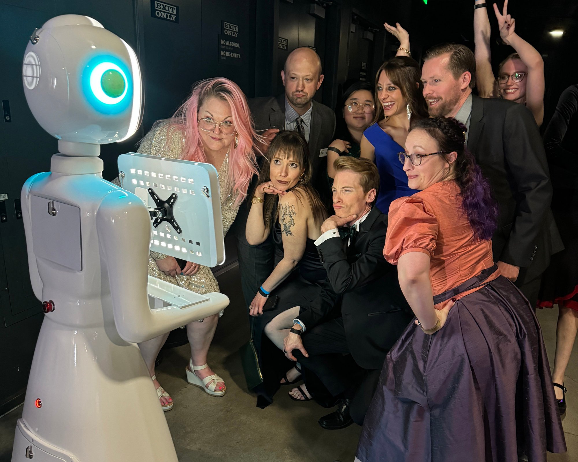Robot photo booth taking photos with party guests at a corporate event in Perth - Perth Robot Hire